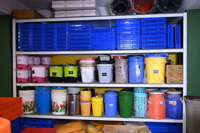 Shelves of crates and buckets